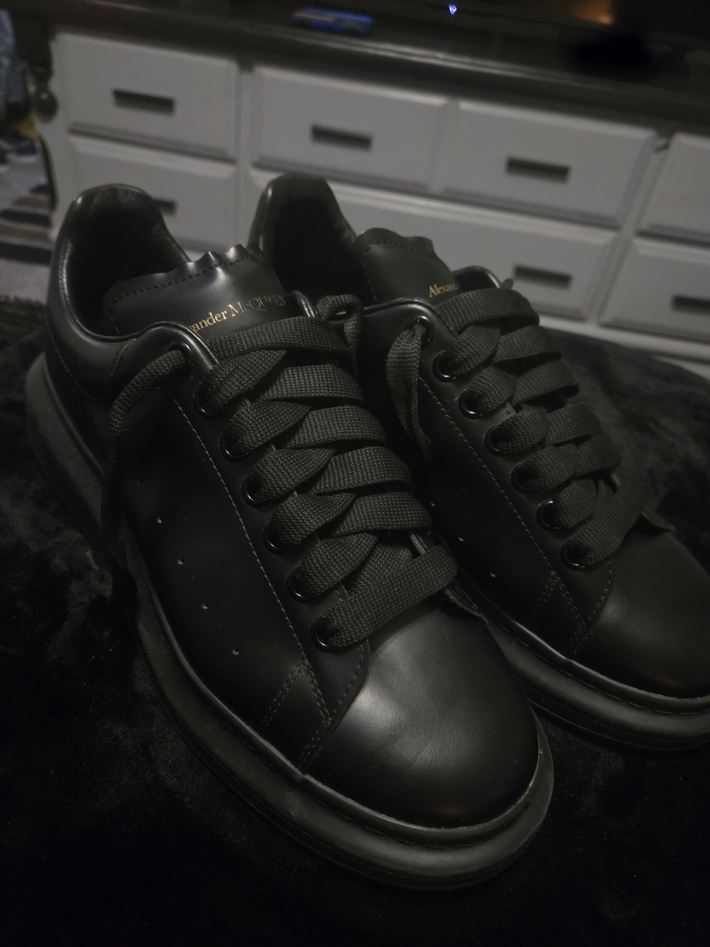 Alexander McQueen Black Leather Low-Top Sneakers with Gold Logo Accent